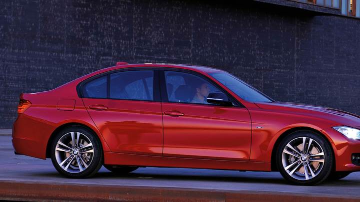 Side Pose Of 2012 BMW 3 Series Sedan F30 In Red